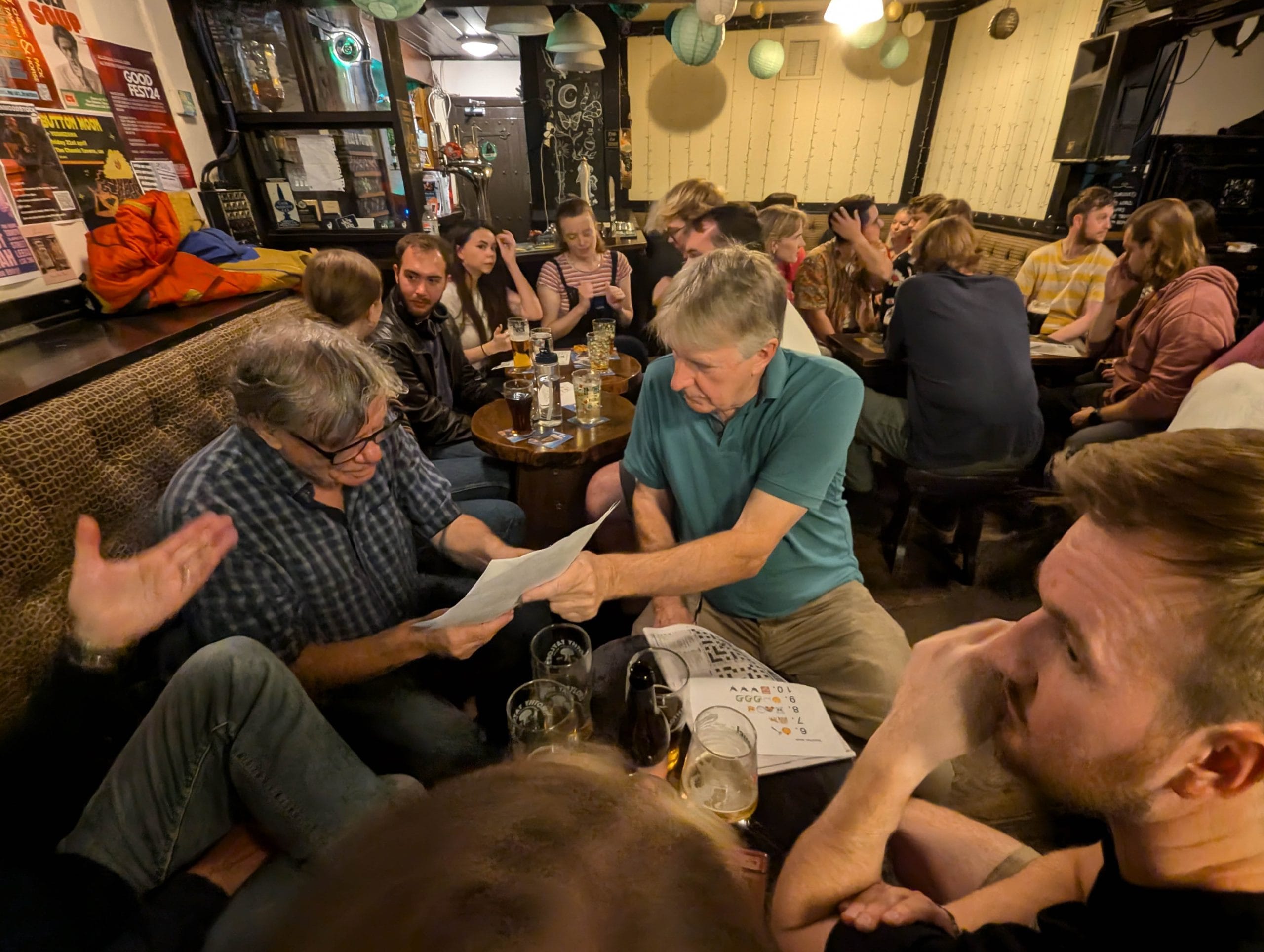 A crowded room filled with pub quiz players